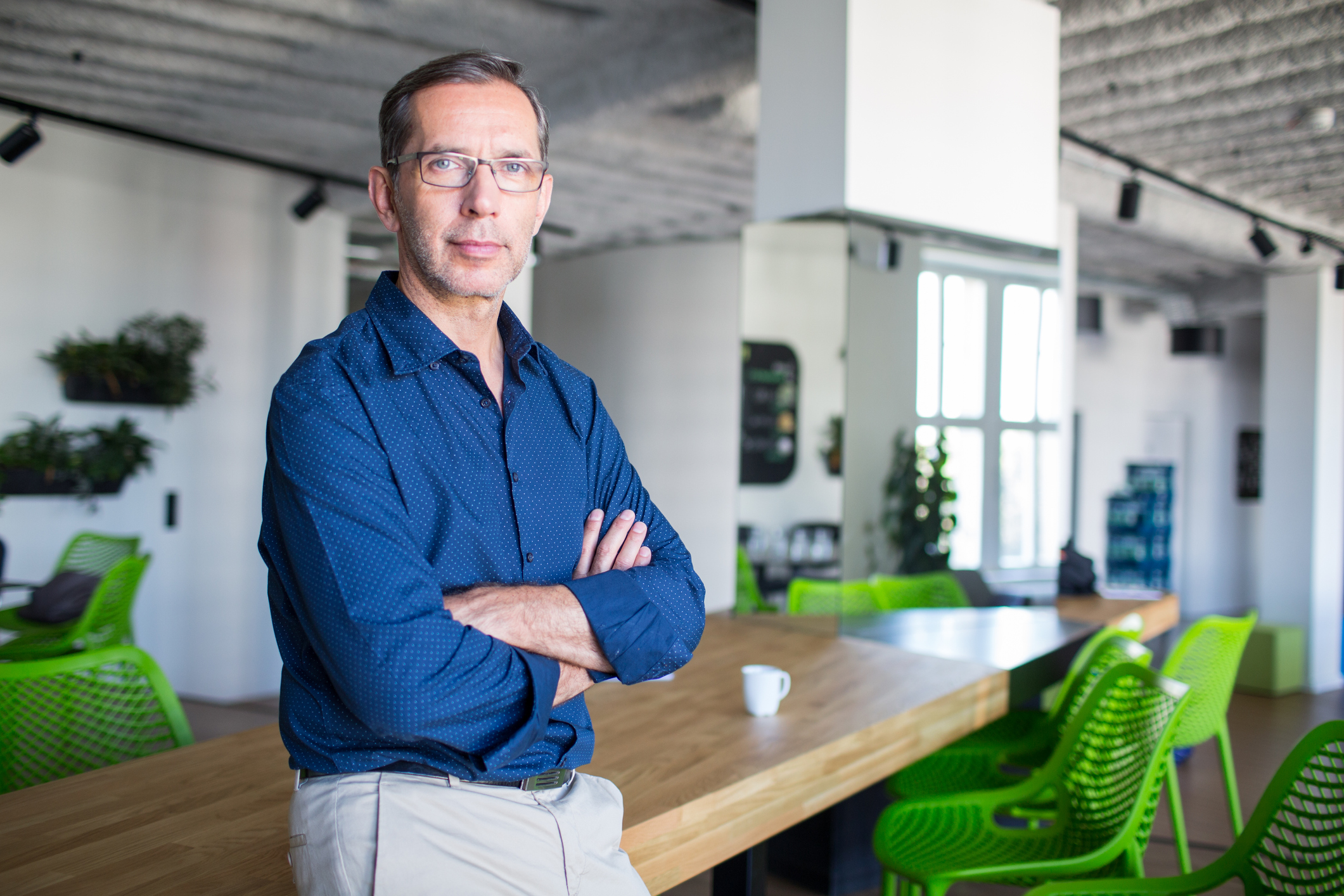 Shot of a successful senior businessman standing in office