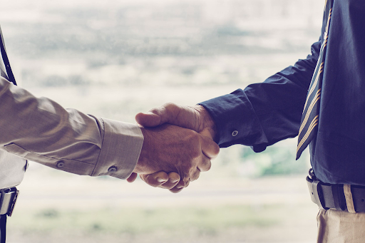 close up of handshake between businessmen