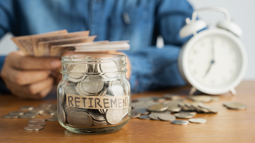 jar with savings labeled retirement with clock in background