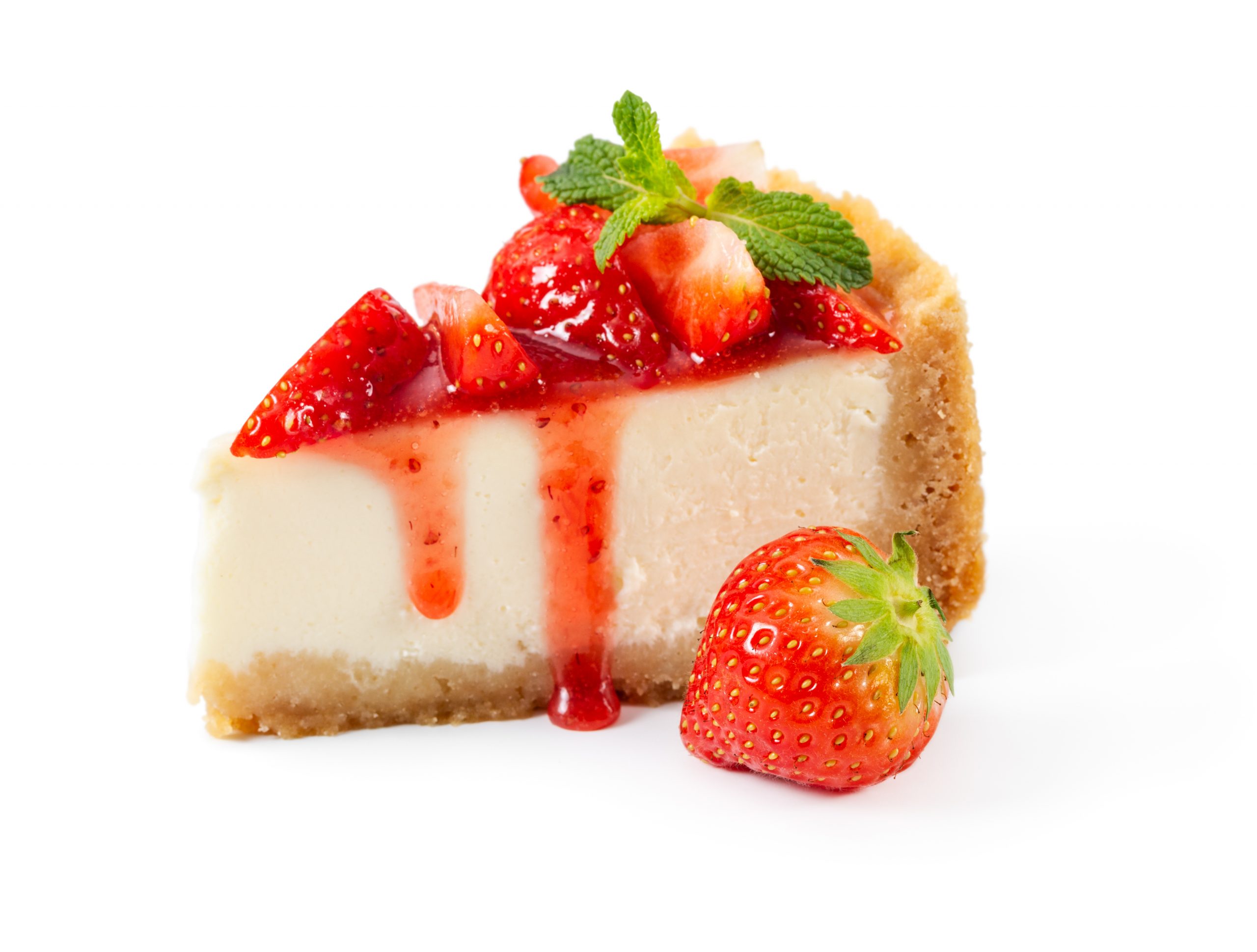 Piece of cheesecake with fresh strawberries and mint isolated on white background